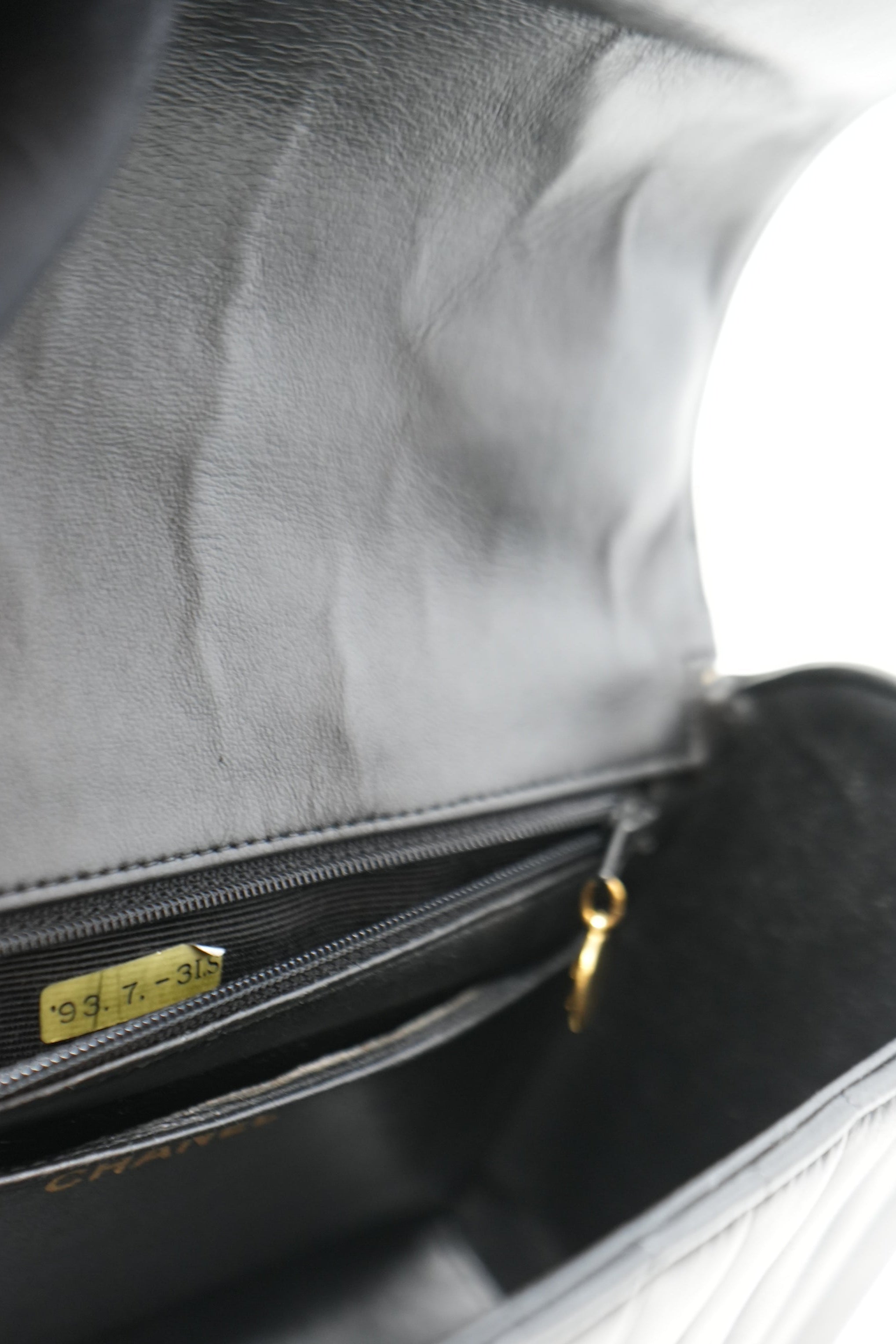 Pre-Owned Chanel 1989–1991 Black Lambskin Chevron Quilted Mini Top Handle Bag