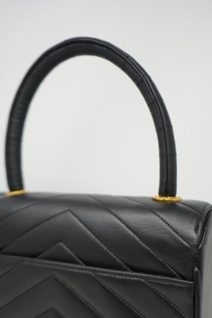Pre-Owned Chanel 1989–1991 Black Lambskin Chevron Quilted Mini Top Handle Bag